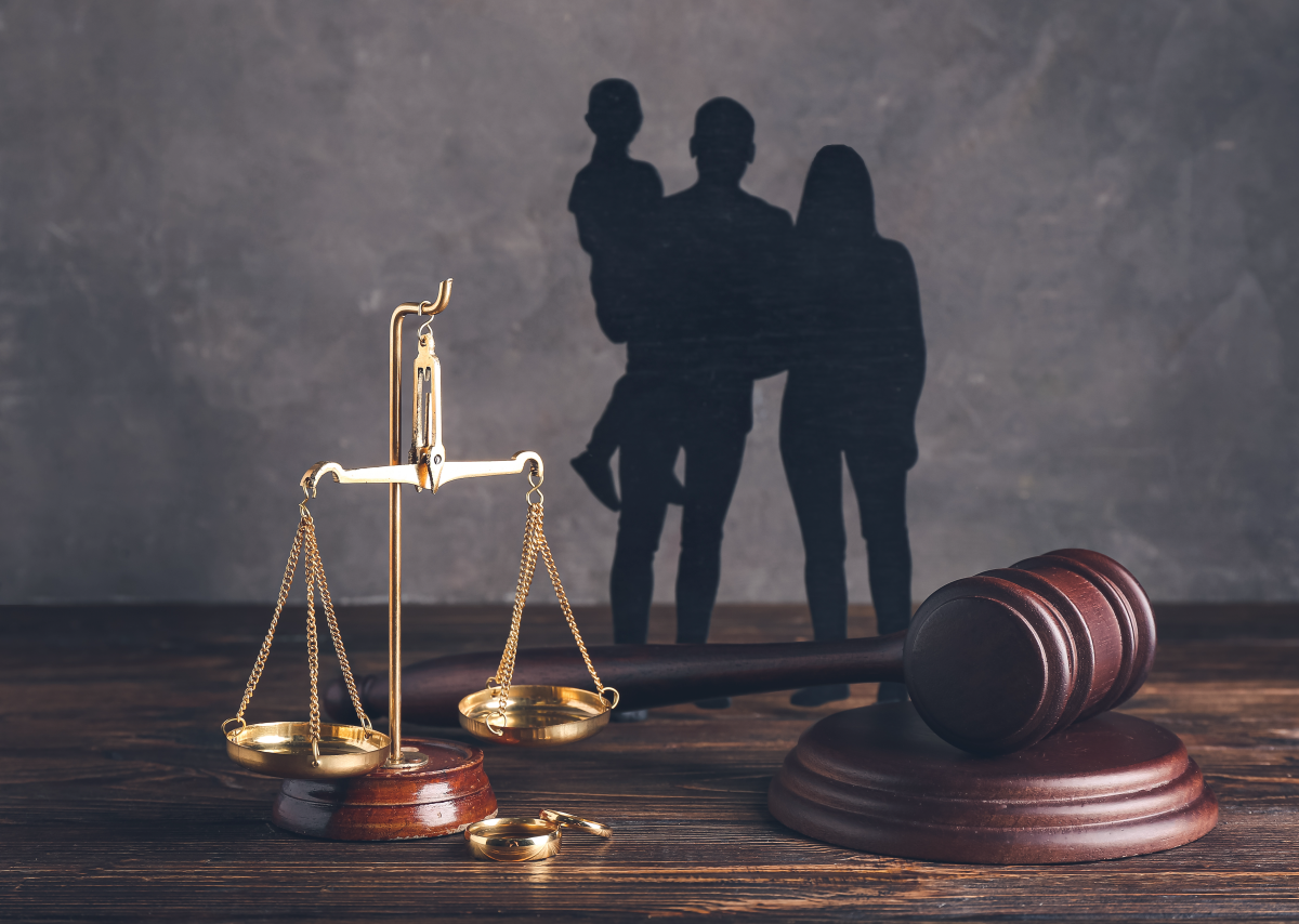 scales of justice next to rings